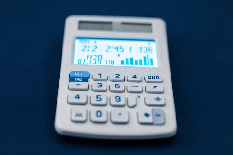 Uma calculadora mostrando números e gráficos financeiros.